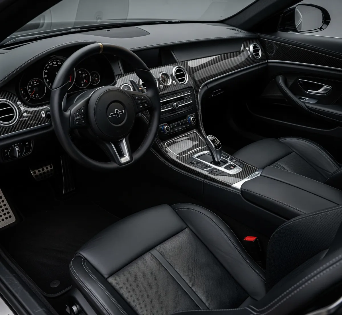 The interior of a car with red leather seats