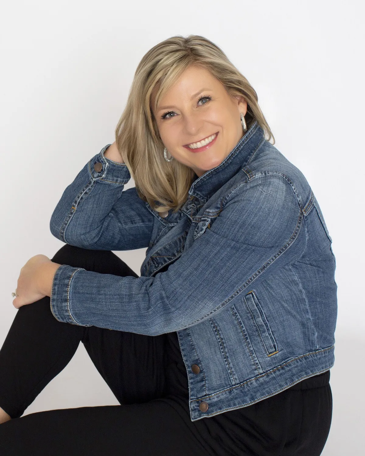 grayscale photo of 3 women sitting on wooden bench