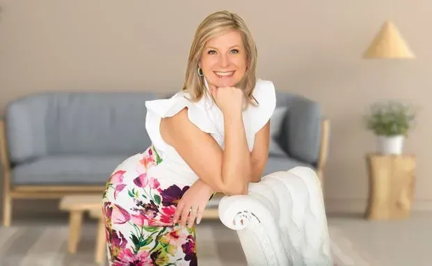 silhouette of boy riding bicycle in wheelie during golden hour