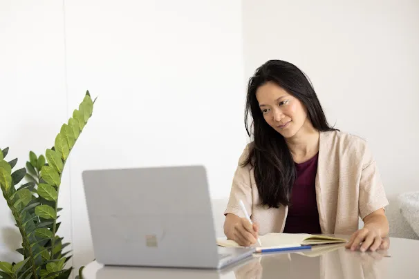Sheryl Ang during her early career as a financial equity research analyst reviewing performance models