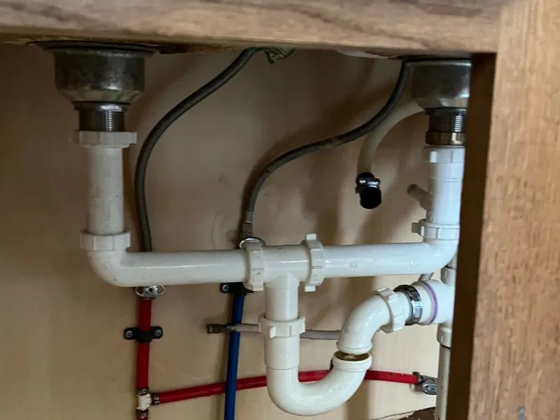 Kitchen sink plumbing pipes and drain connections