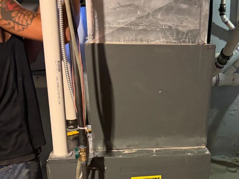 Working on the air conditioners evaporator coil