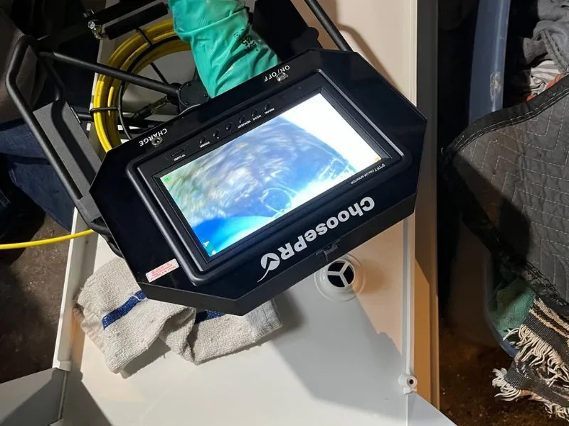 WorryFree Home Services sewer inspection camera monitor used to evaluate underground drain and sewer pipe conditions