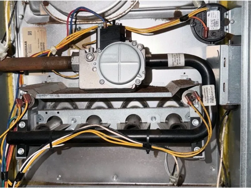 Interior gas furnace components inspected during furnace repair and maintenance