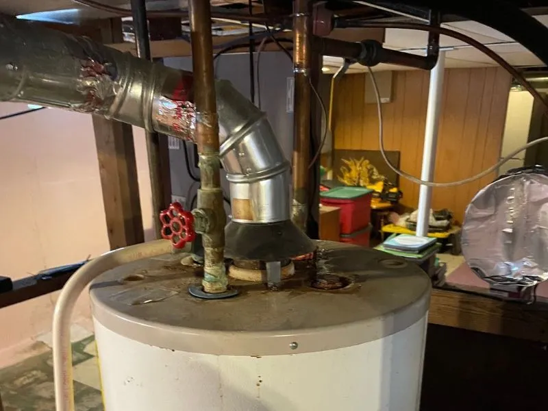 Residential gas water heater with vent piping in a Buffalo, NY home – WorryFree Home Services