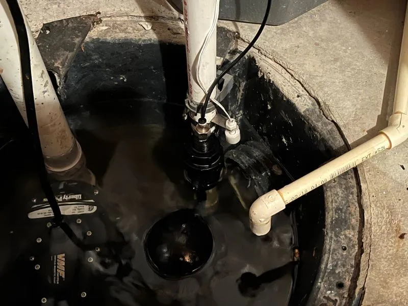 Professional drain cleaning equipment clearing a bathtub drain in a Buffalo, NY home