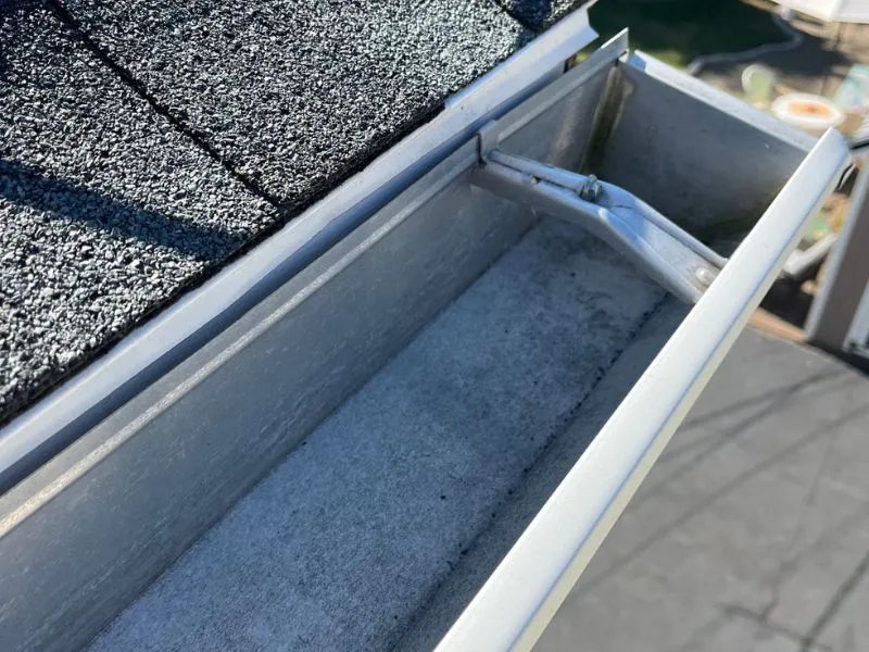 Clean residential rain gutter free of leaves and debris after gutter cleaning service in Amherst, NY