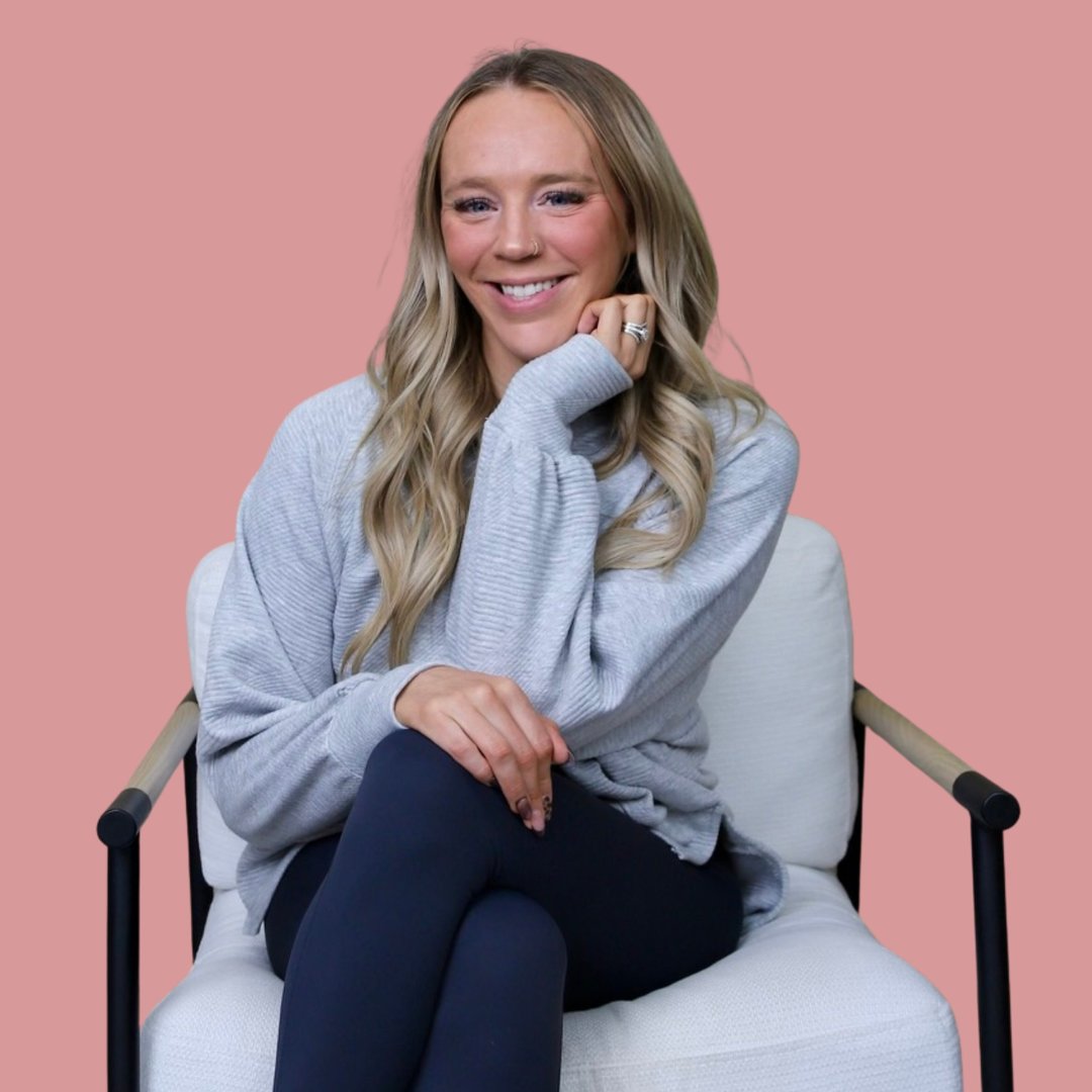 Portrait of Tiff, a woman in her late 30s with warm brown skin, short curly hair, wearing a soft pink blouse, smiling gently against a neutral background. 1:1 aspect ratio.
