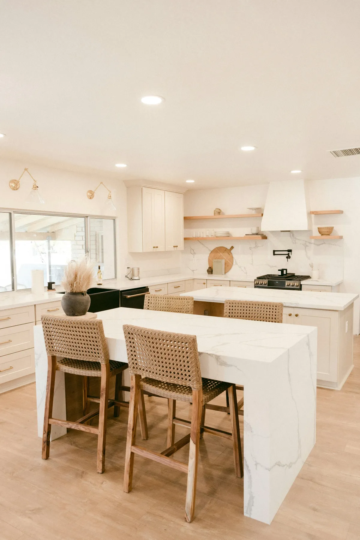 Tidy kitchen with island and tall stools