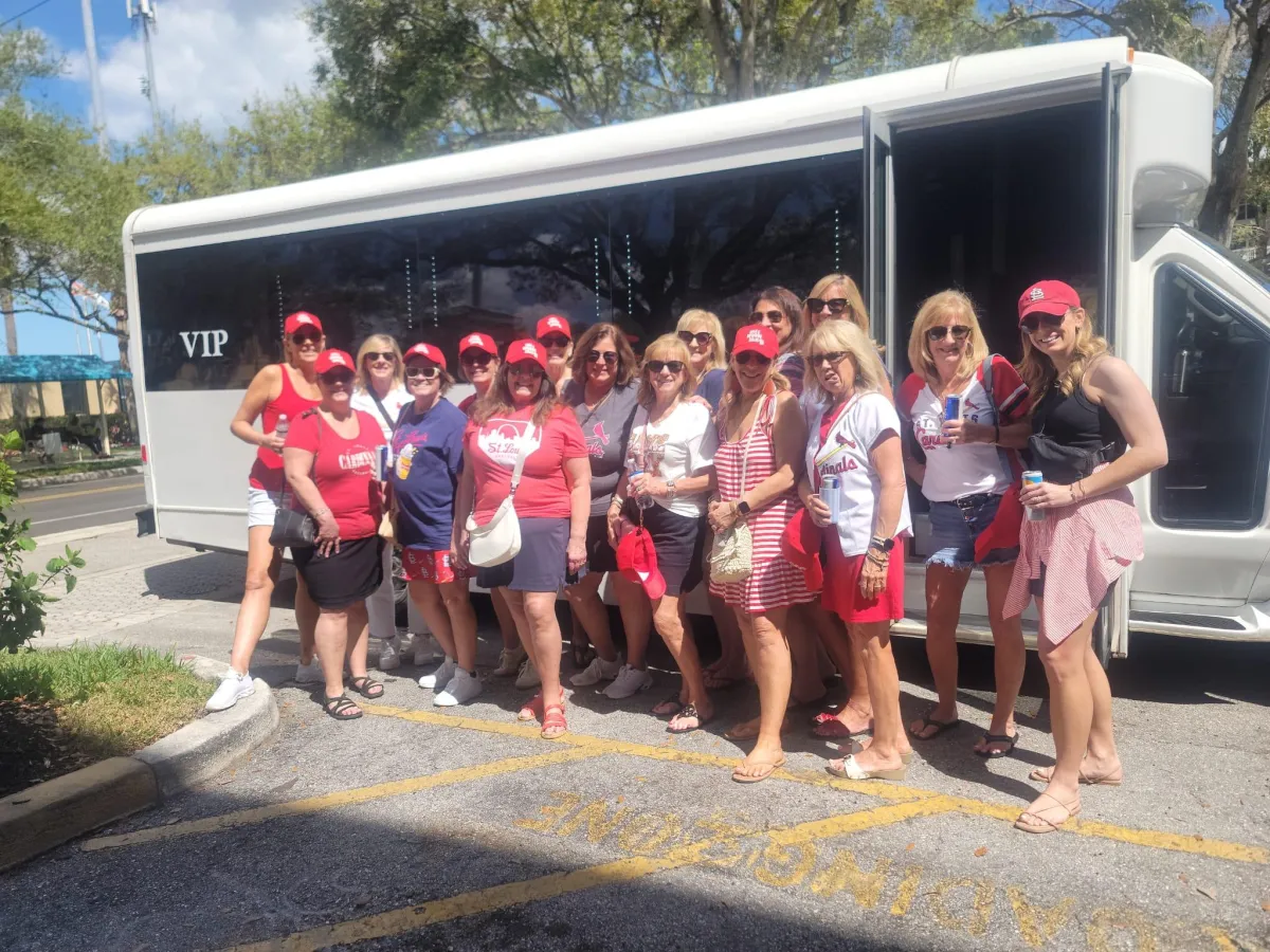 People ride on a trolley car in the city.