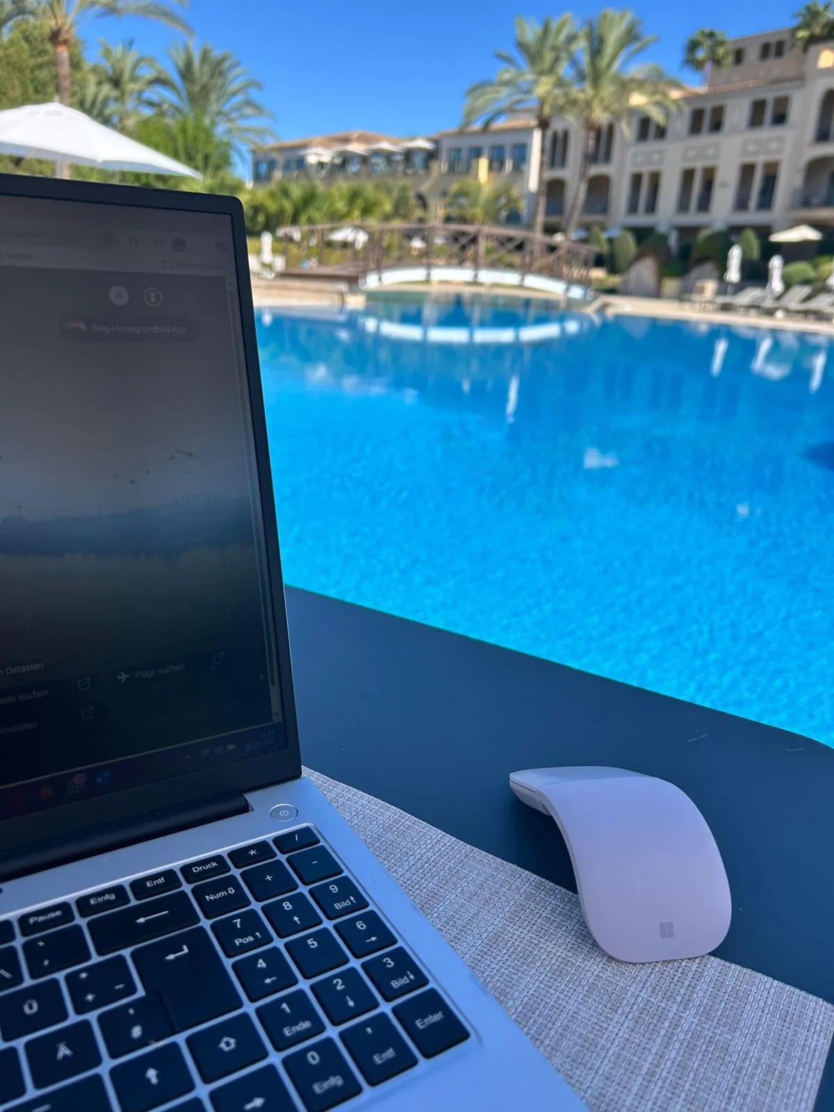 a white wall with a reflection of a light on it