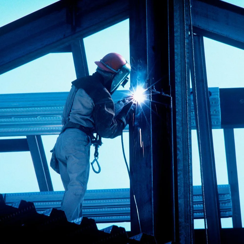 metal fabricator at work welding