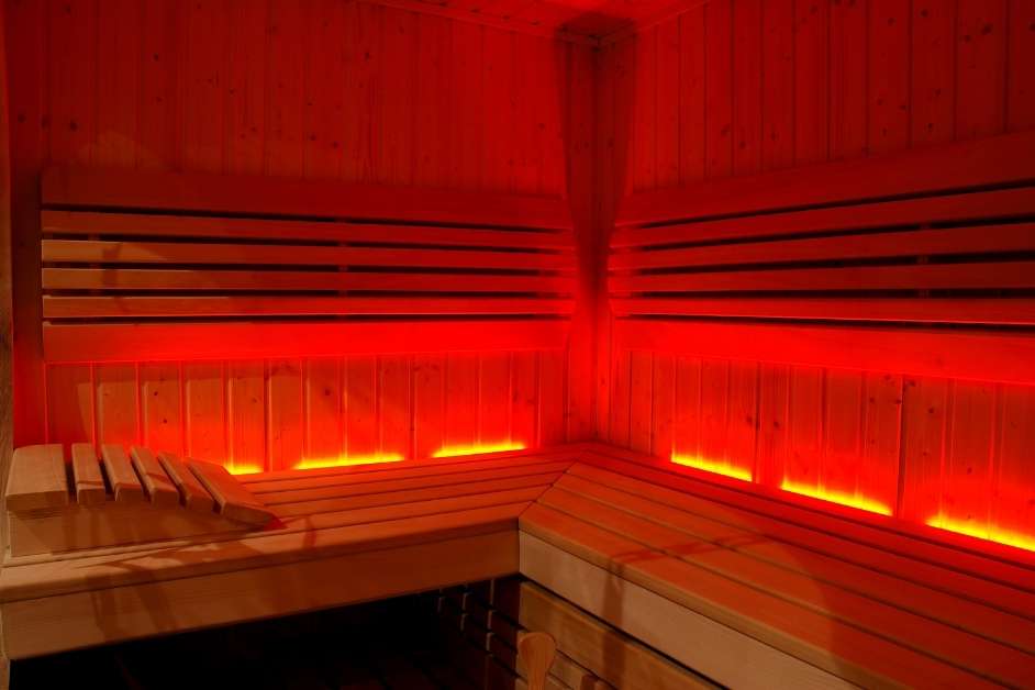 Infrared sauna interior with purple LED glow in a Tucson home