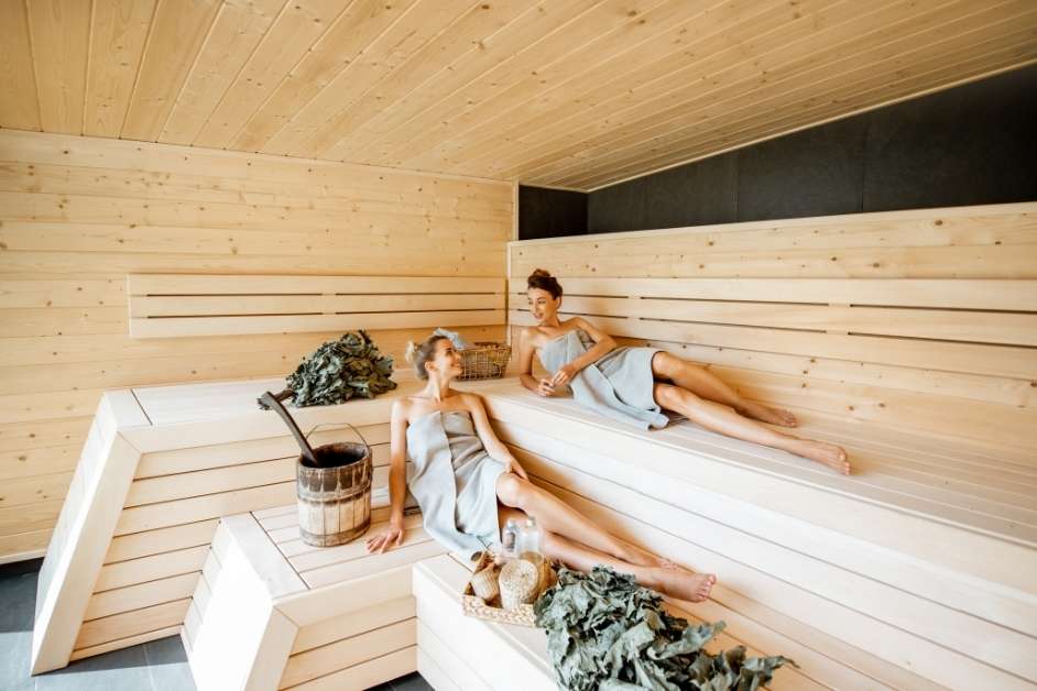 Person enjoying a custom built sauna interior