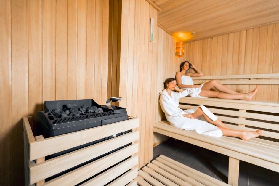 Couple relaxing in a custom cedar sauna