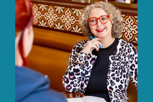 SuzanneUlph of the Curious wolf talks with a client