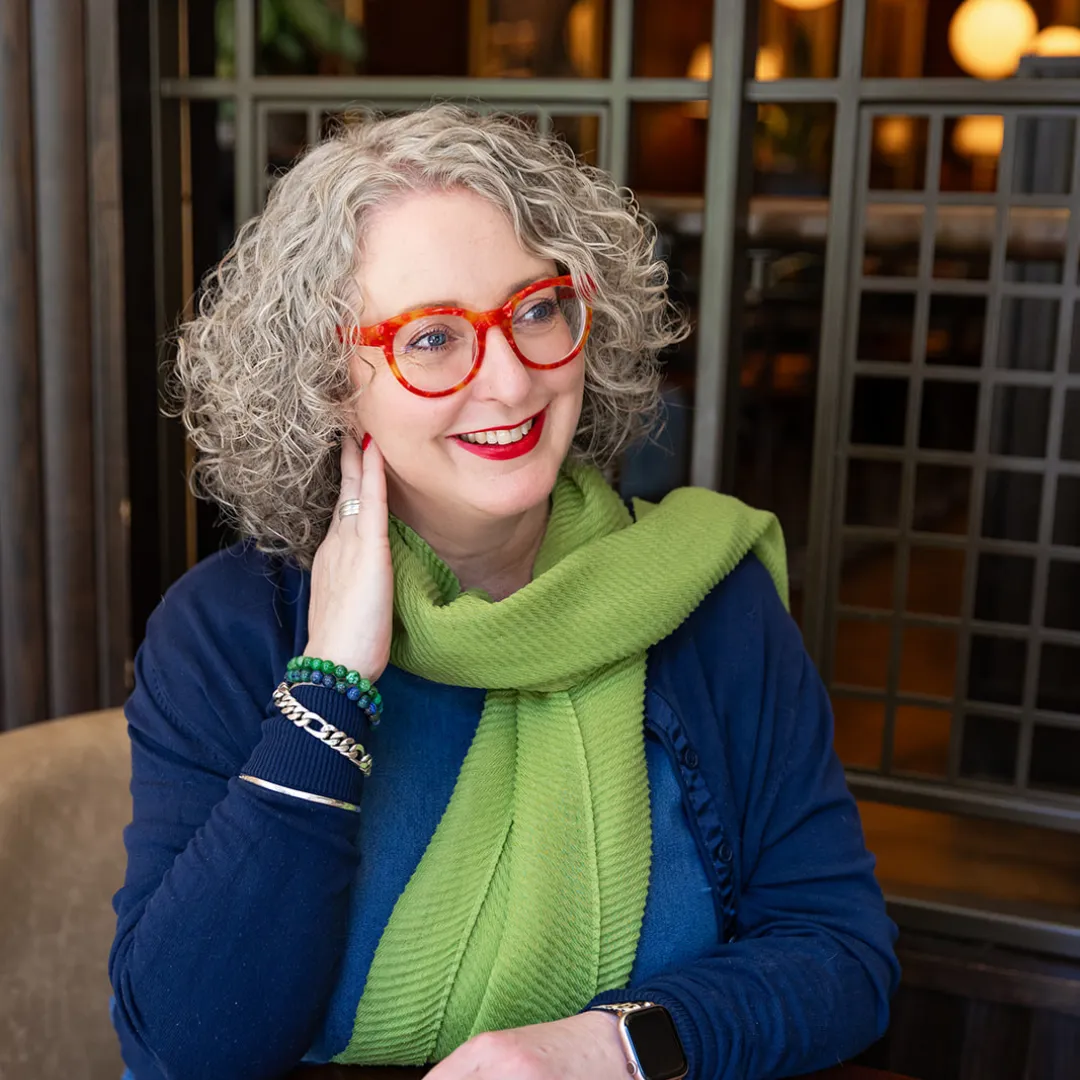 High-contrast editorial portrait of an author refining strategic non-fiction arguments