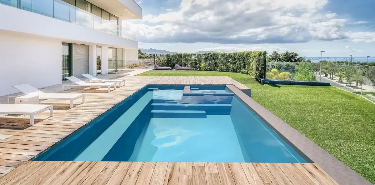 Luxurious backyard in-ground pool with water features and LED lighting in Madison, Wisconsin.