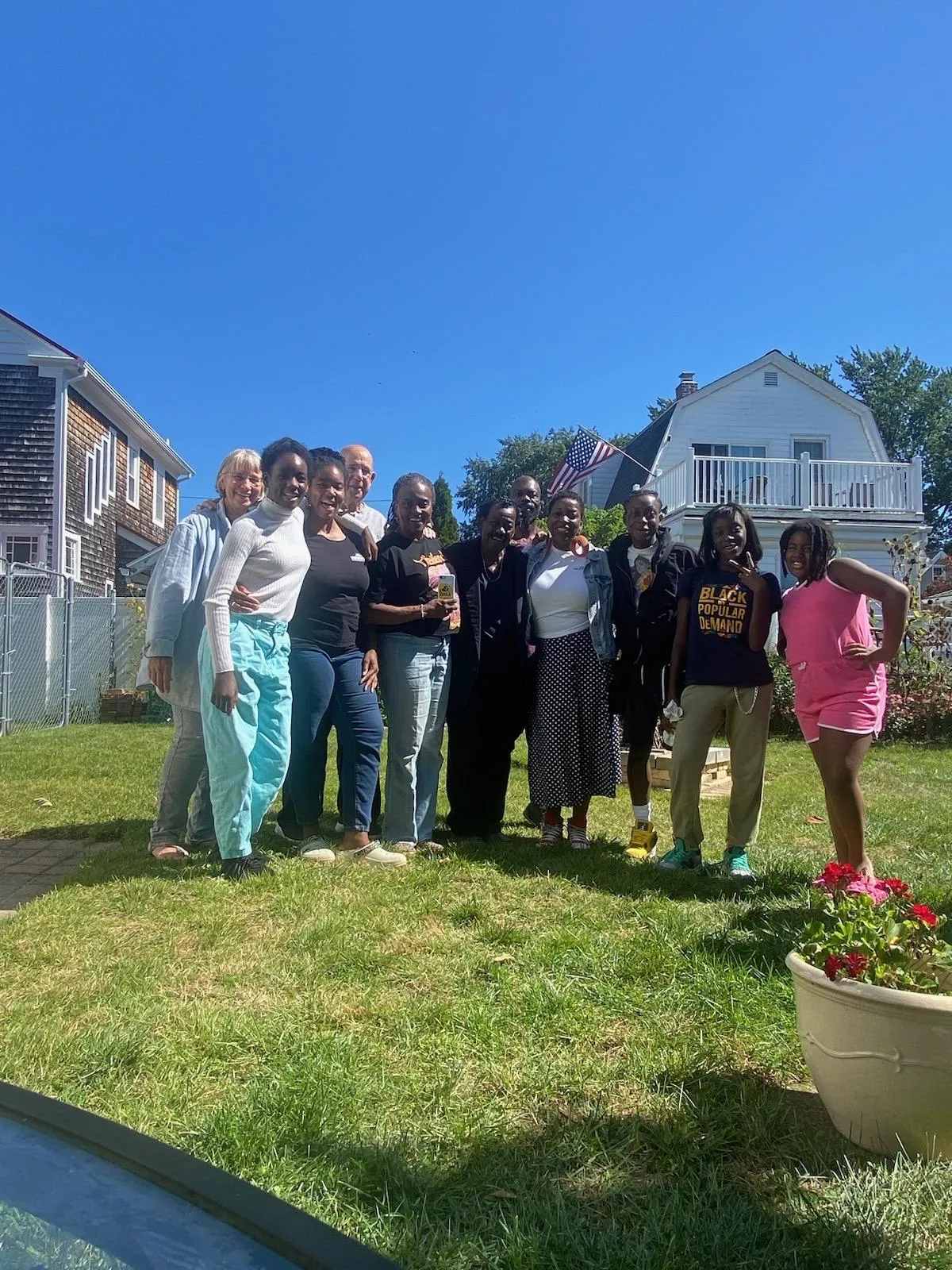 SAHGE Academy student outside with family and friends.