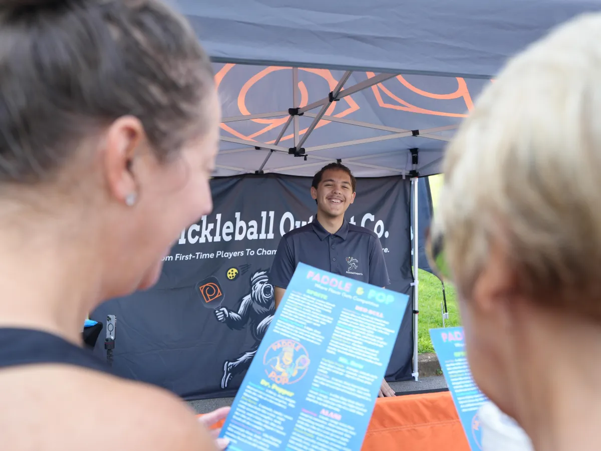 Two customers looking over the menu to Paddle & Pop