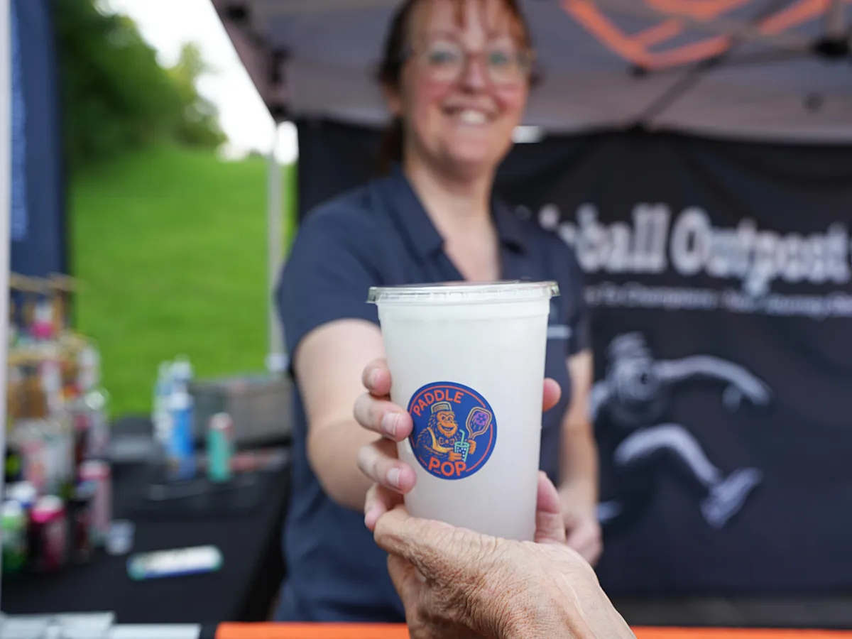 One of Paddle & Pop's mixers giving a drink to a customer