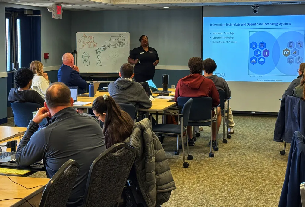 Monique teching Physical and Cybersecurity for Critical Infrastructure in Nashua, NHv