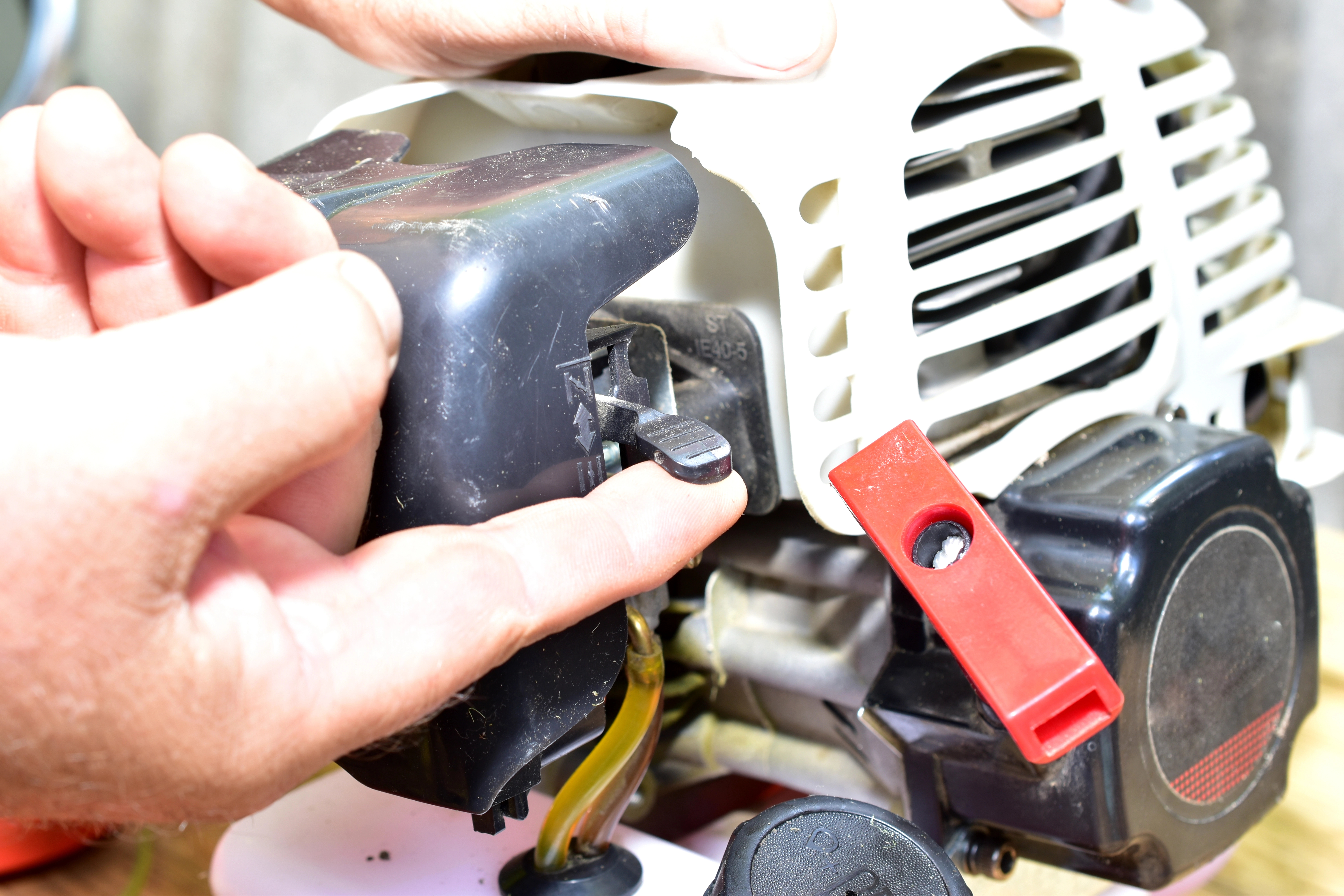Friendswood Small Engine Repair — technician servicing a small engine with precision tools