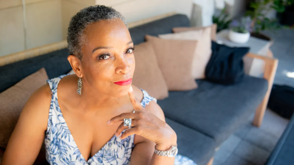 woman holding brown umbrella