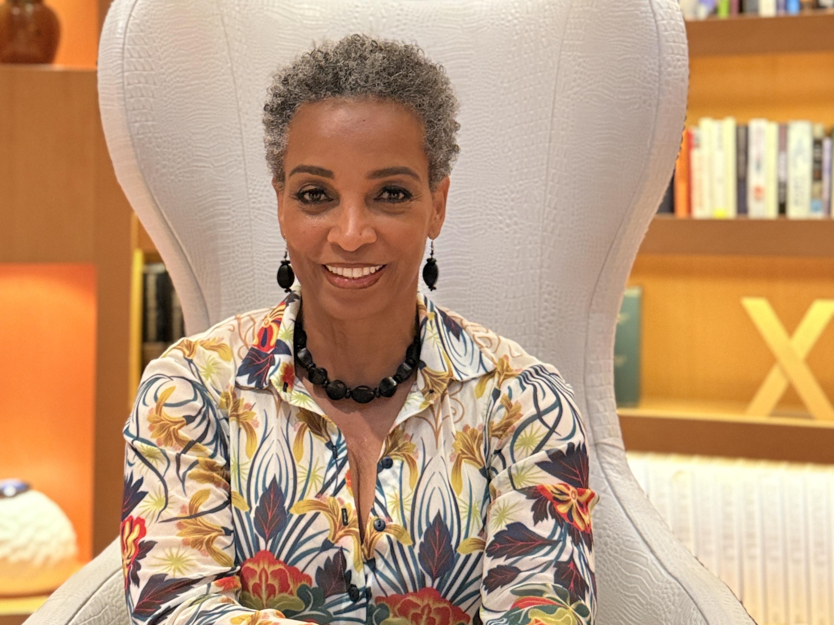 woman holding brown umbrella