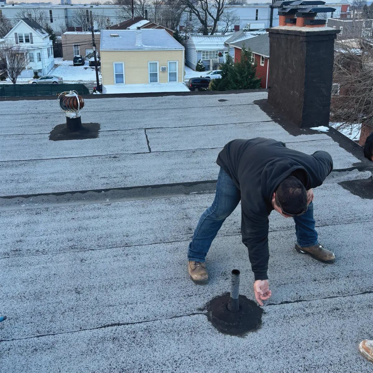 Flat roof replacement on a commercial building in Passaic County, NJ by New Path Roofing using durable, weather-resistant materials for long-term protection
