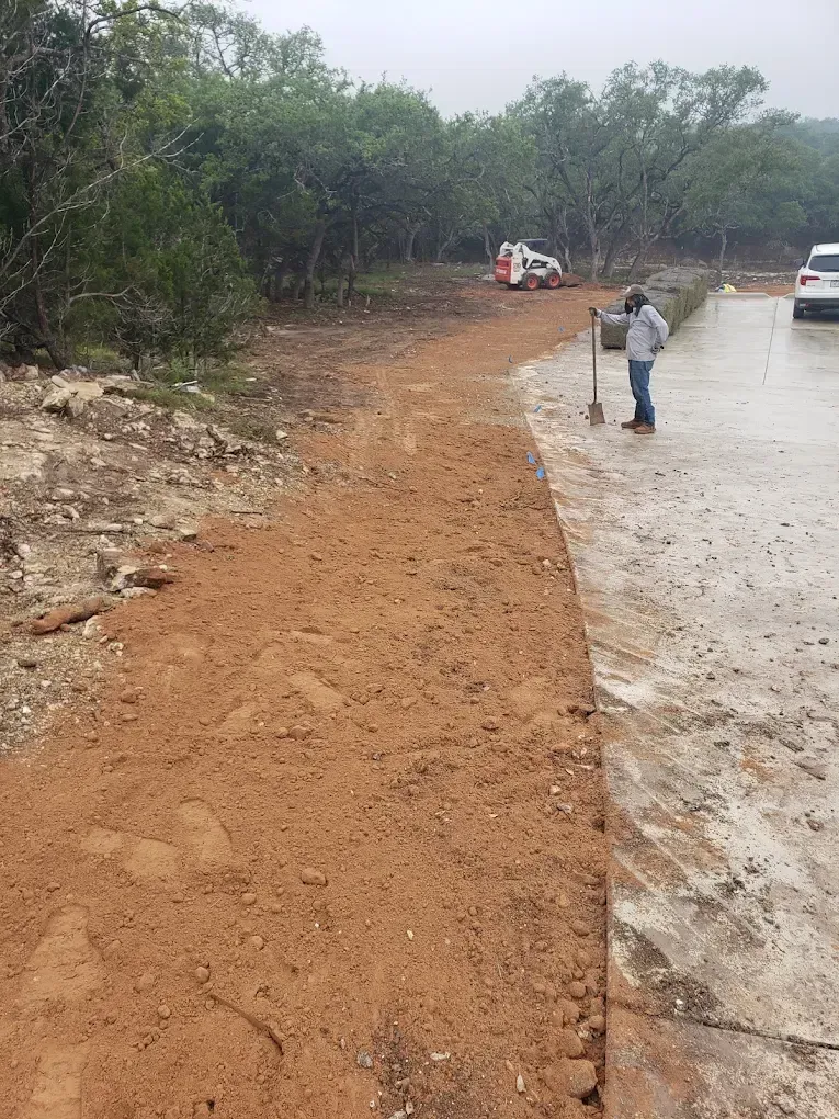 Land clearing project preparing a residential property for landscaping.