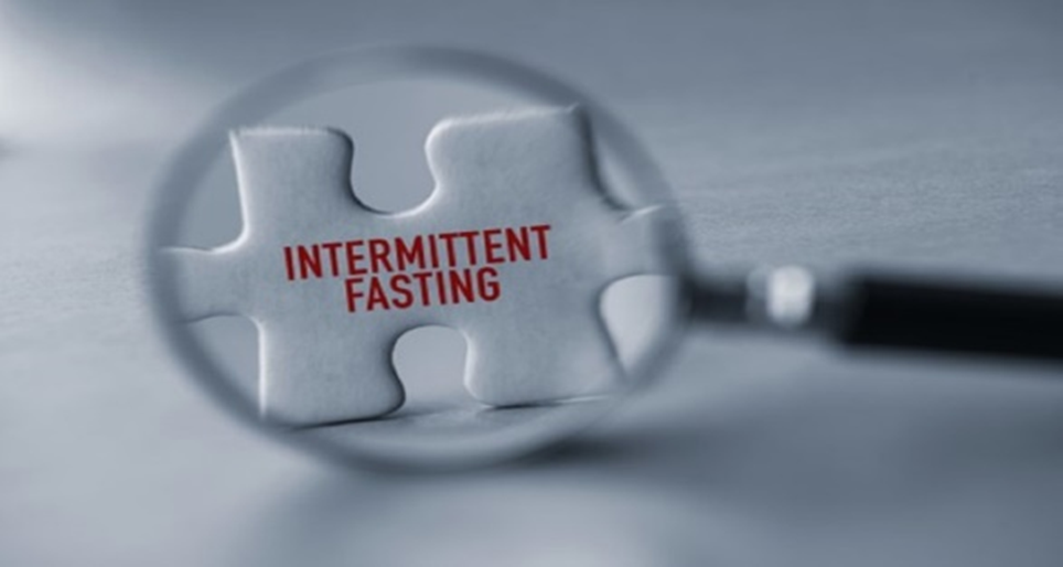 Intermittent fasting concept - magnifying glass examining puzzle piece