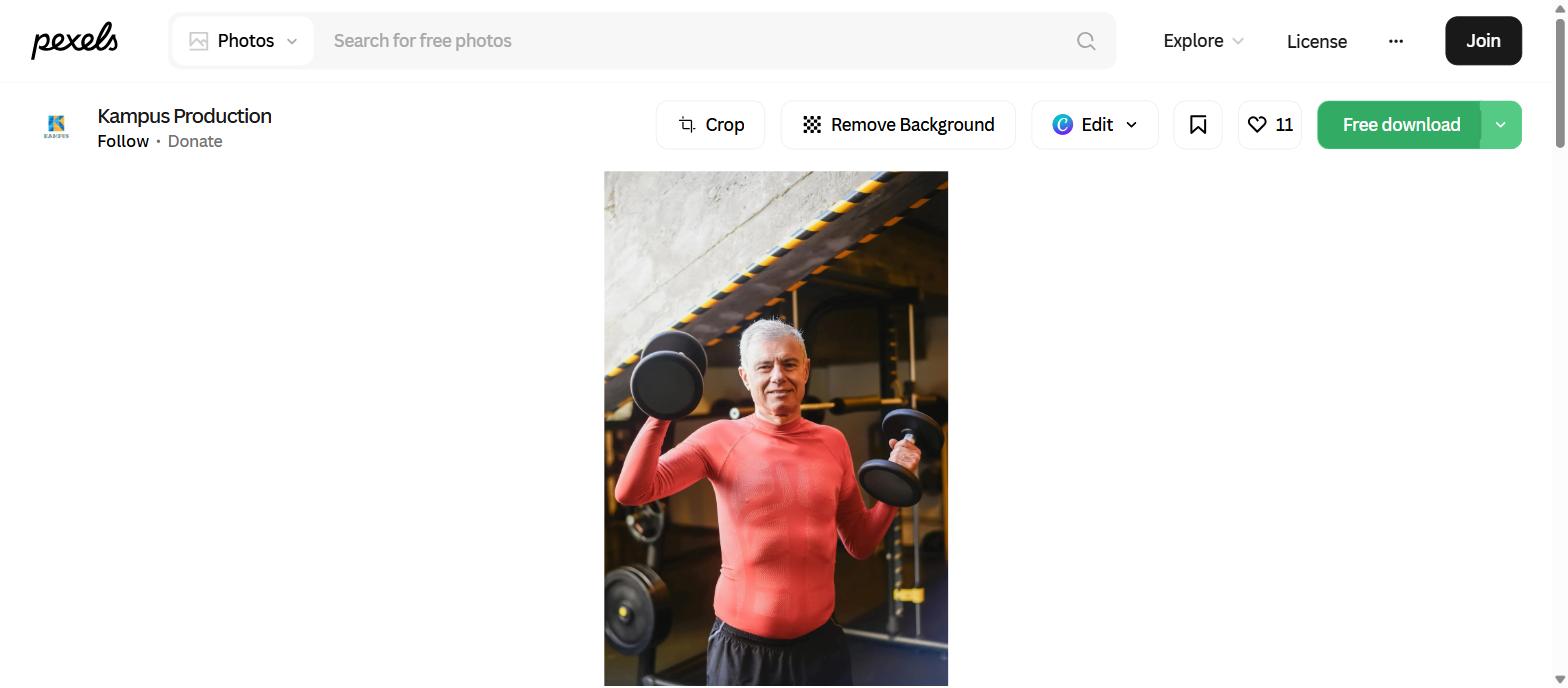 Mature man lifting dumbbells in gym