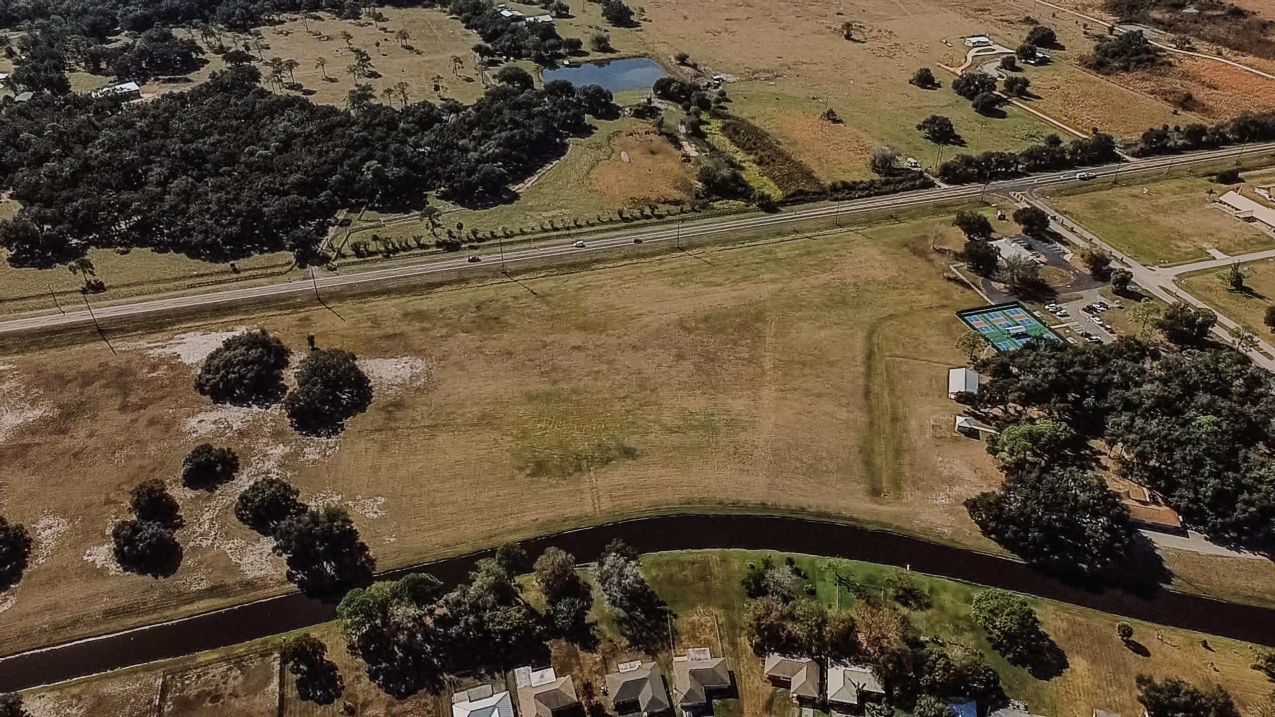 Modern houses on a hillside overlooking the water