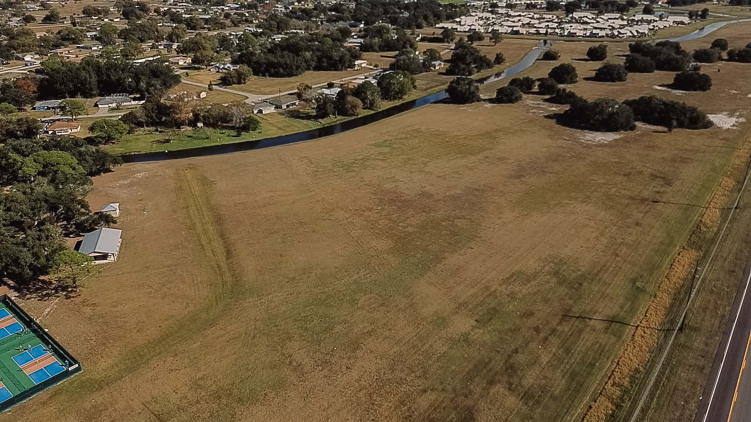 Modern houses on a hillside overlooking the water