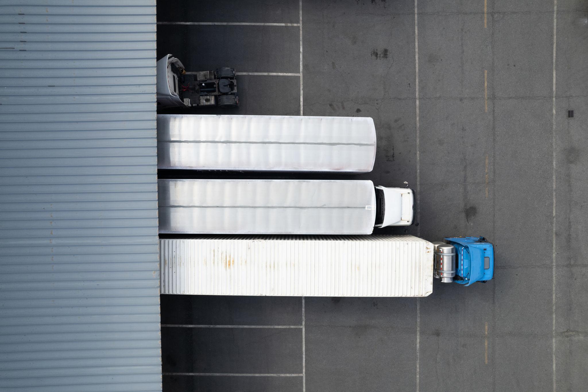 a large stack of colorful shipping containers