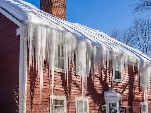 Roof ice dam prevention and removal by Bloomington Lawn & Snow