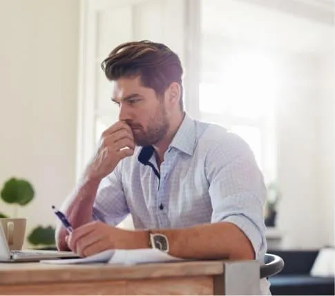 Man calculating his mortgage affordability  for a rent to own option in Canada. 