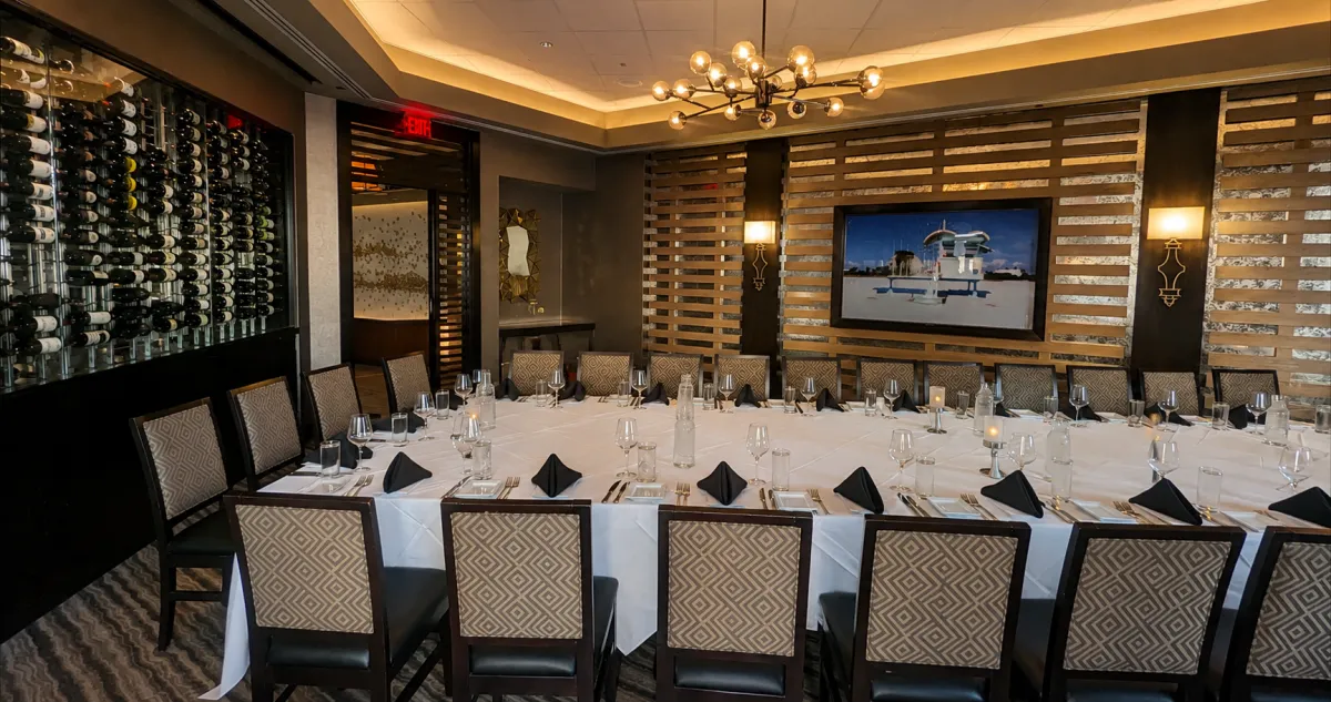 a long table with a bunch of glasses on it