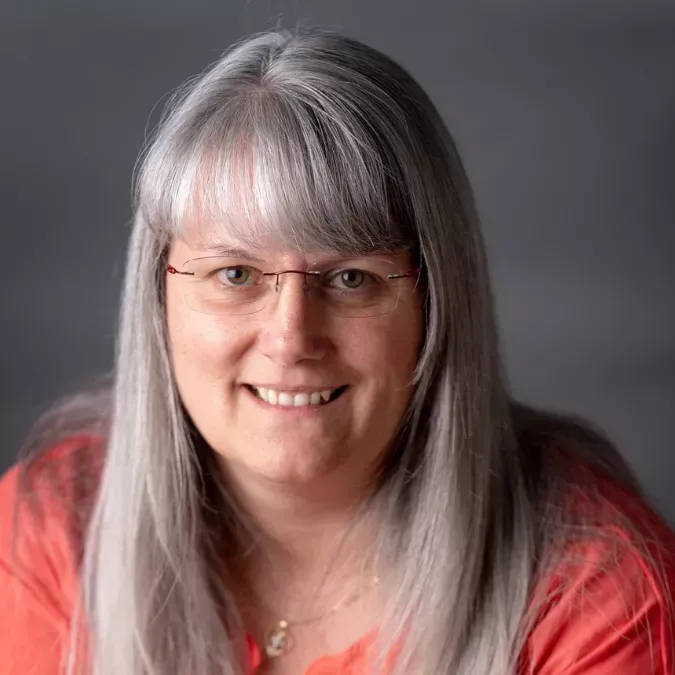 Melanie, owner of Promise Bookkeeping, smiling in a professional headshot.