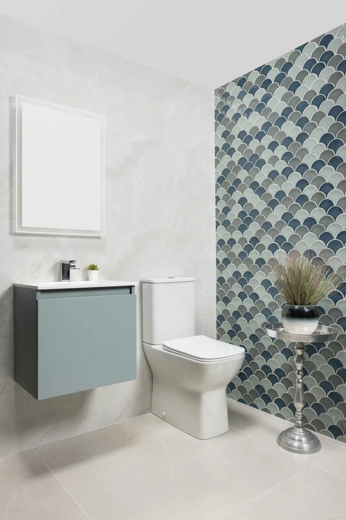 white and blue tiled wall in bathroom