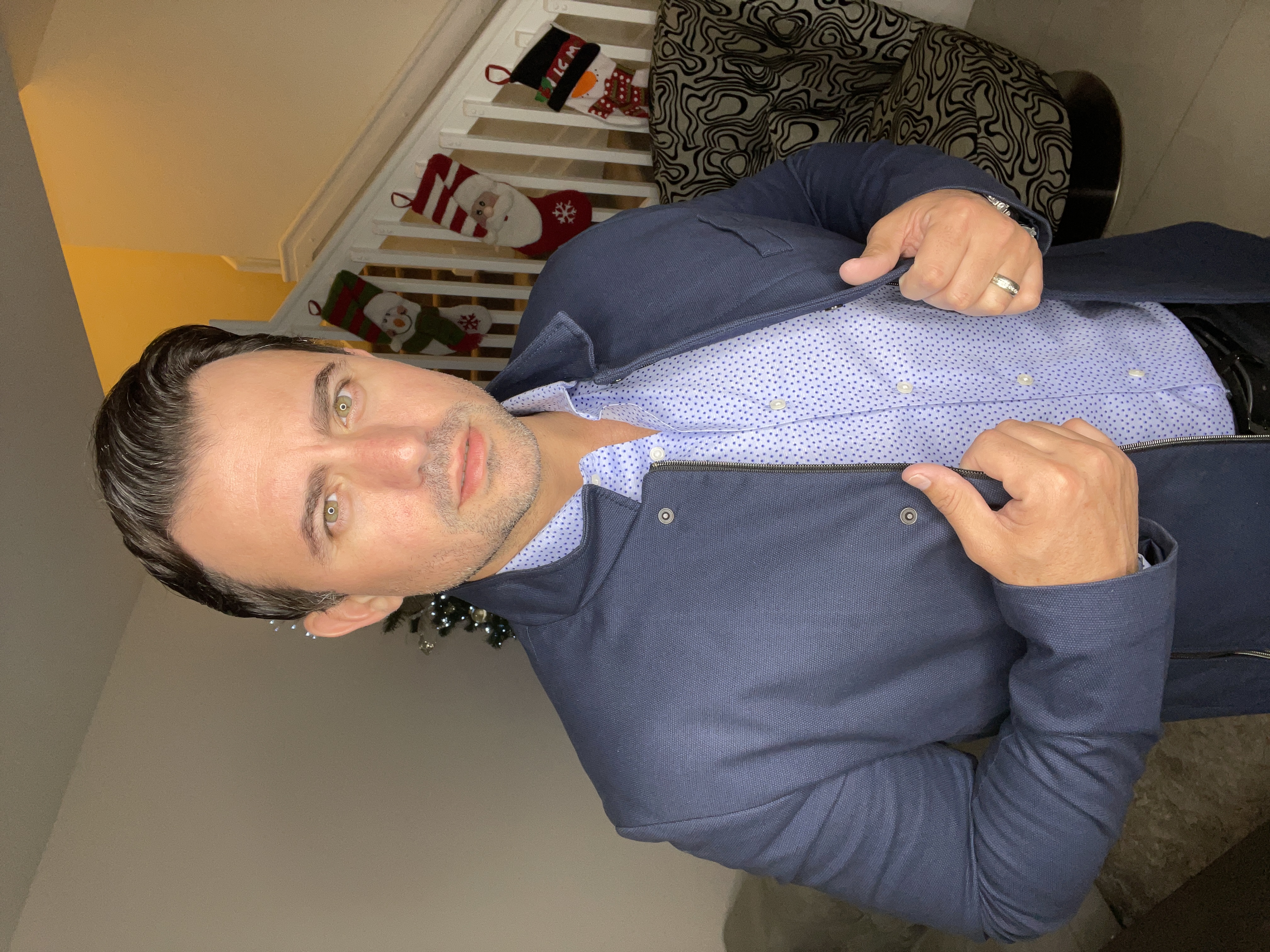 man wearing watch with black suit