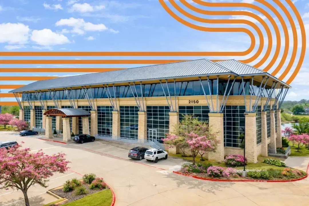 Sunlit private office at Foster Coworking McKinney with warm interior finishes