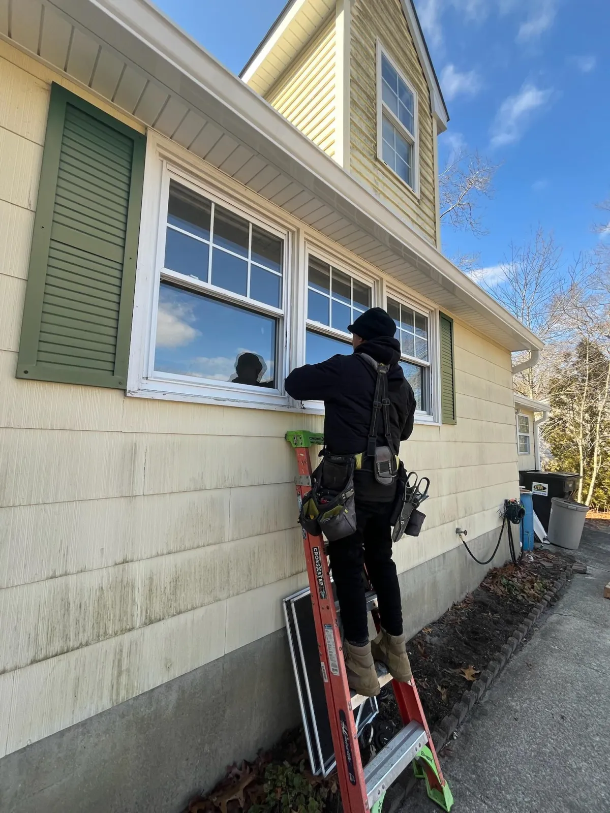 Veterans Roofing crew servicing windows on a South Jersey home