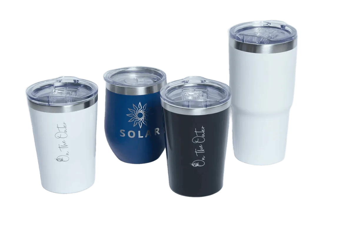 Four insulated tumblers in white, blue and black with On the Outer and Solar branding
