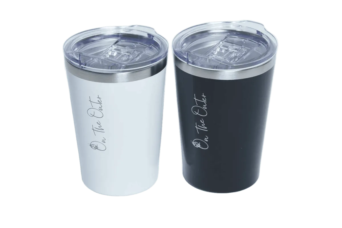 White and black insulated tumblers with On the Outer branding