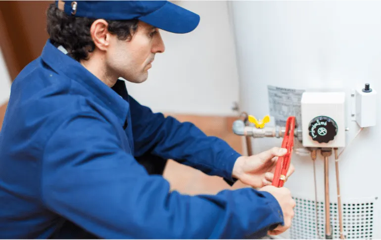 Plumber repairing a water heater – Expert water heater repair and installation in San Antonio, TX by 2nd Opinion Plumbing.