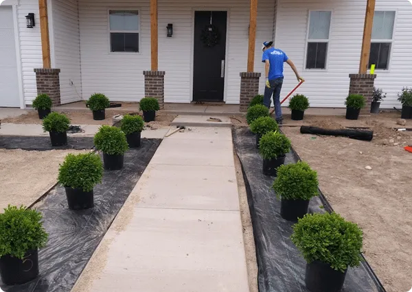 Plumber fixng leak repair under bathroom sink in San Antonio