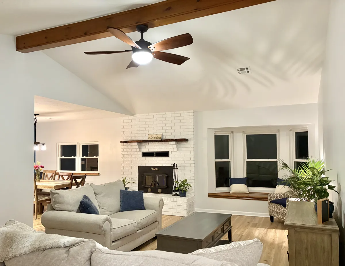 Bright renovated kitchen with shaker cabinets and granite countertops