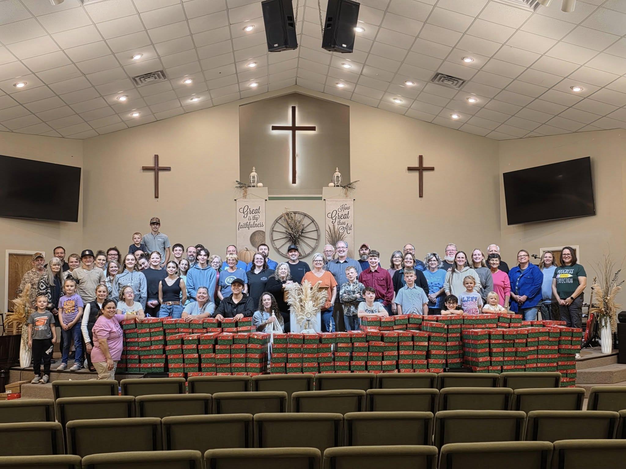 silhouette of child sitting behind tree during sunset
